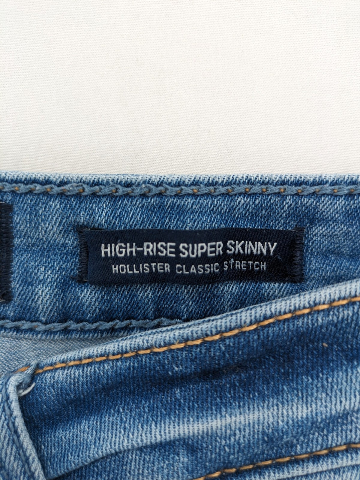 Hollister blue high rise super skinny jeans with frayed hem and classic stretch denim.