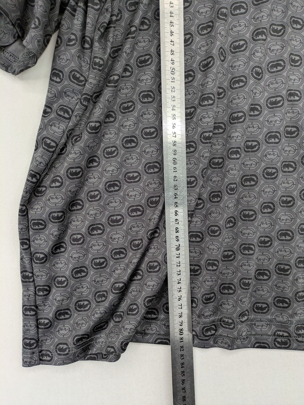 Ecko Unltd. grey soccer uniform V-neck with all-over logo print and embroidered FC patch.