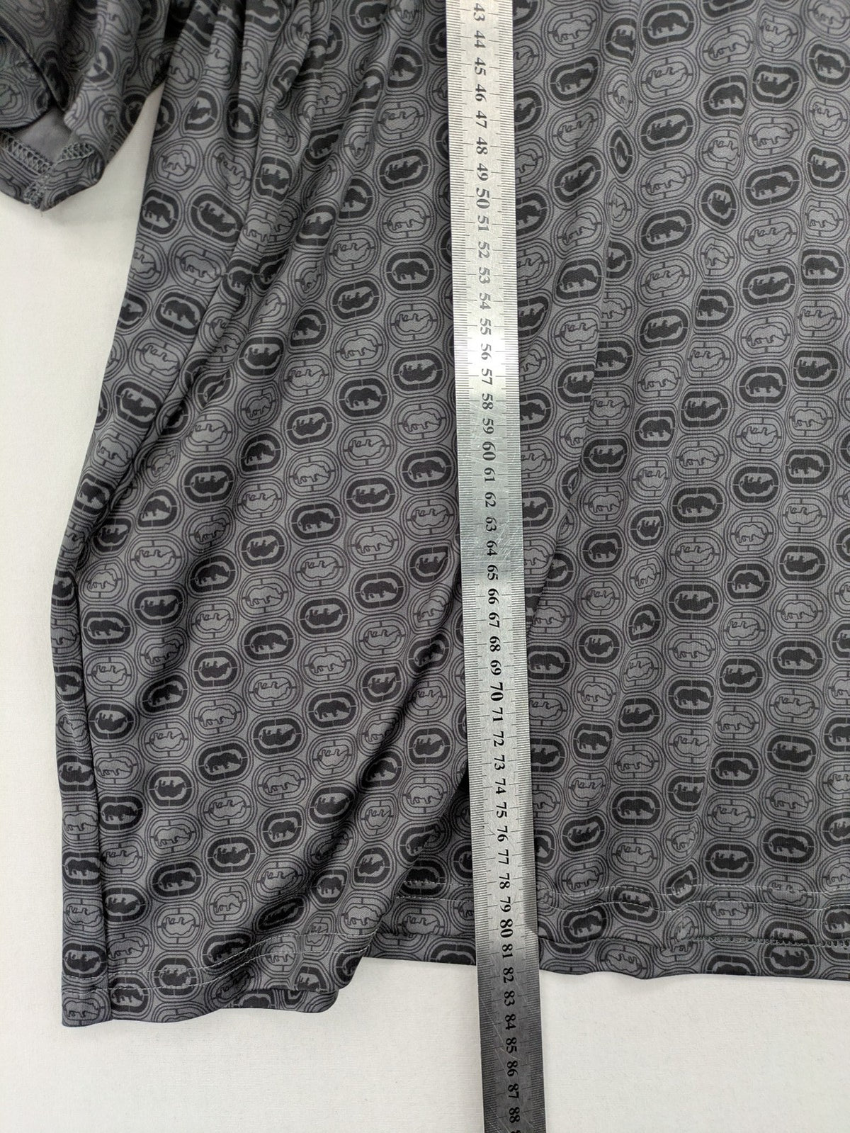 Ecko Unltd. grey soccer uniform V-neck with all-over logo print and embroidered FC patch.