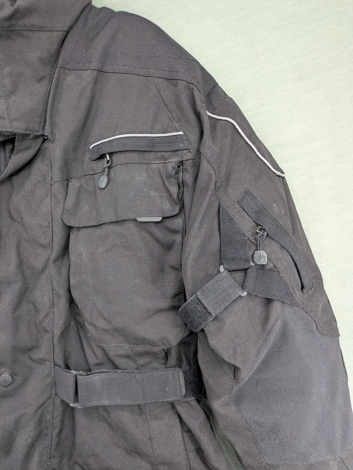 Advanced Experience black motorcycle jacket with Z-Liner membrane and CE protectors, durable Cordura material.