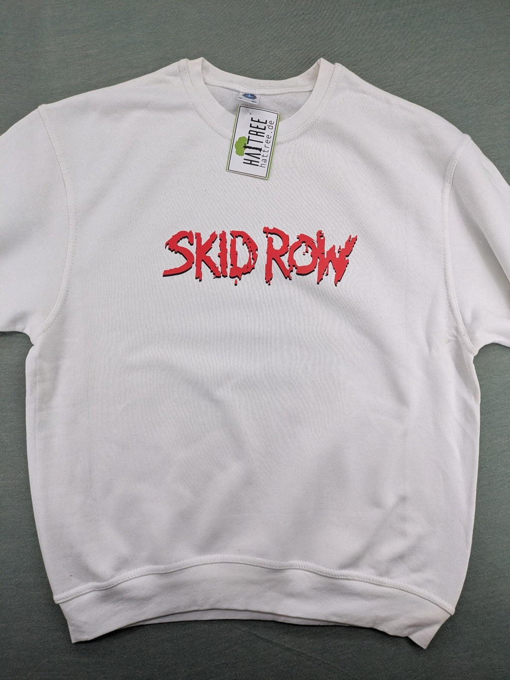 Skid Row white sweatshirt with red dripping logo, cotton-polyester blend, crewneck style.