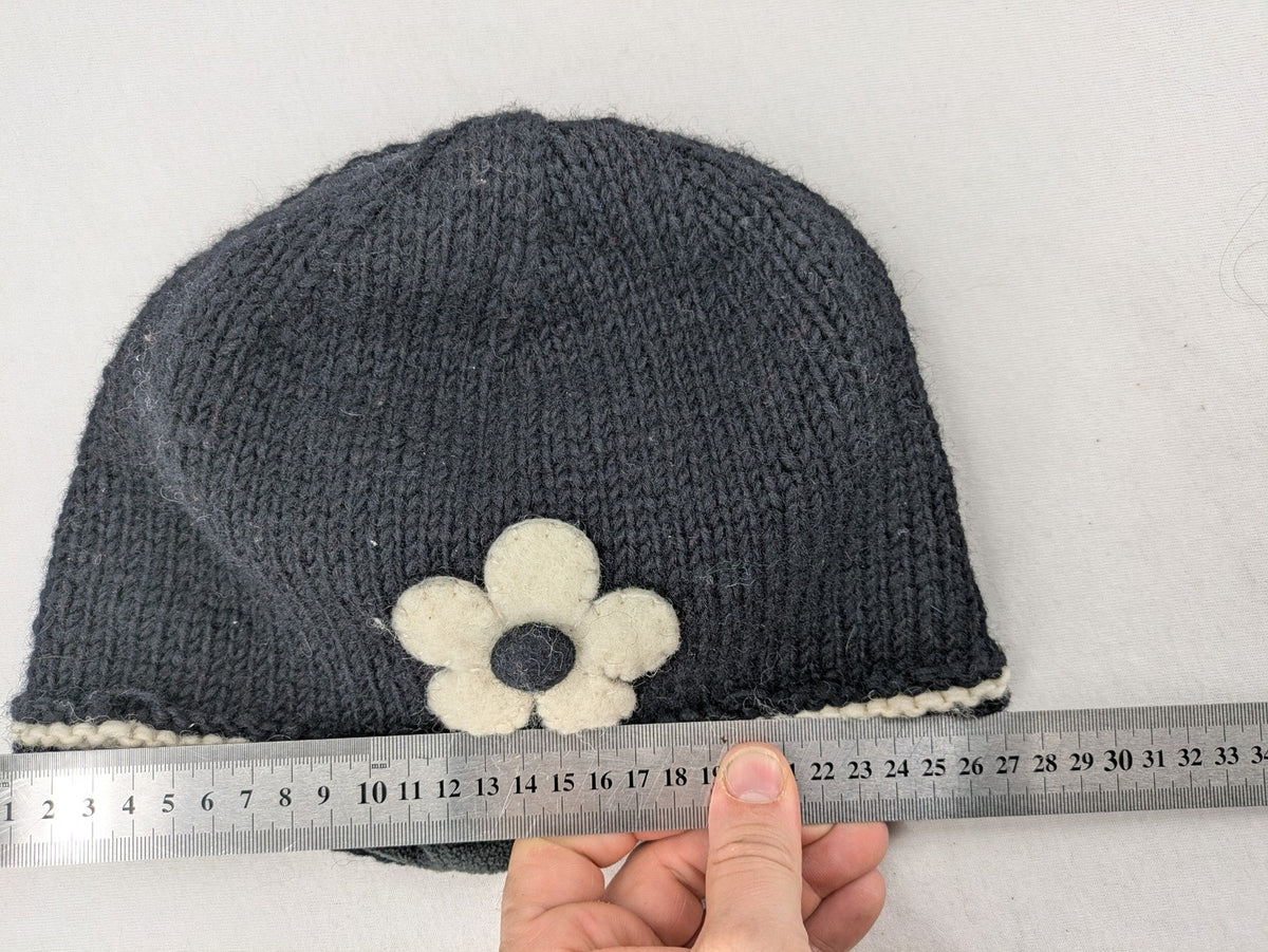 Fischers Textil multi beanie hand-knitted wool with fleece lining and floral appliqué.
