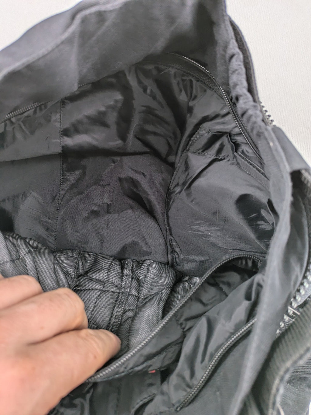 iXS black chaps with grey accents, waterproof textile, adjustable belt, reinforced knees.