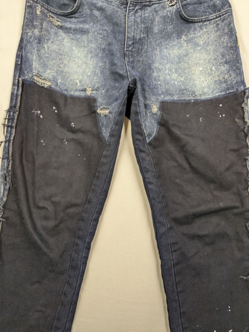 Reternity straight jeans blue black patchwork design with distressed details and frayed seams.