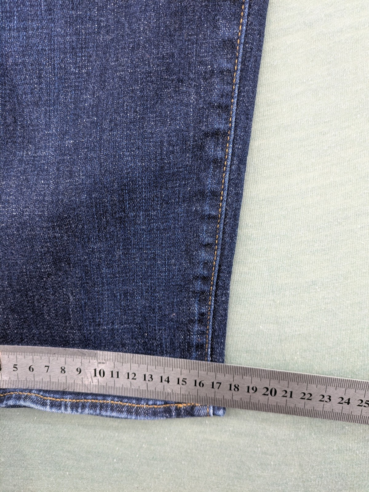 Armani Exchange blue slim fit jeans with distressed details and classic 5-pocket design.