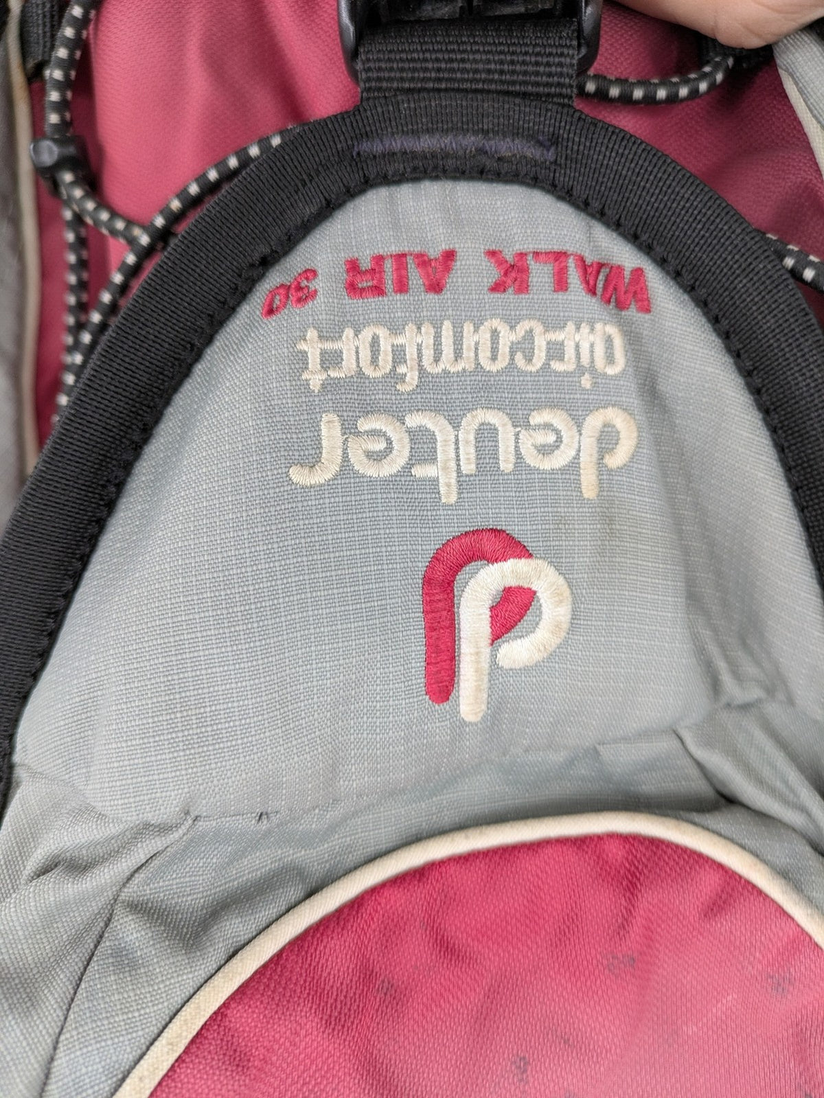 Deuter grey and pink Aircomfort Walk Air 30 rucksack with mesh back system.