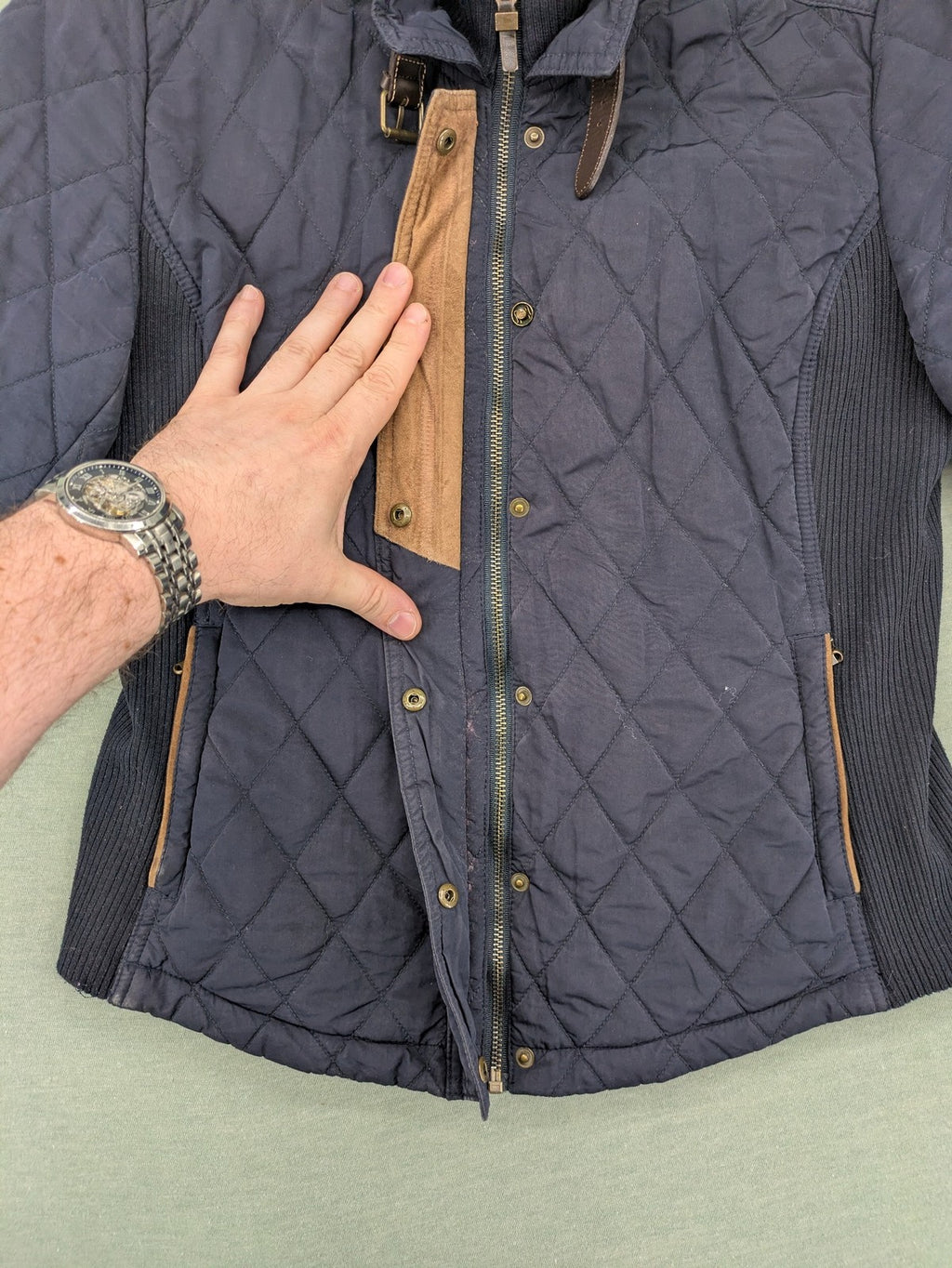 Massimo Dutti black quilted jacket with contrasting brown trim and ribbed side inserts.