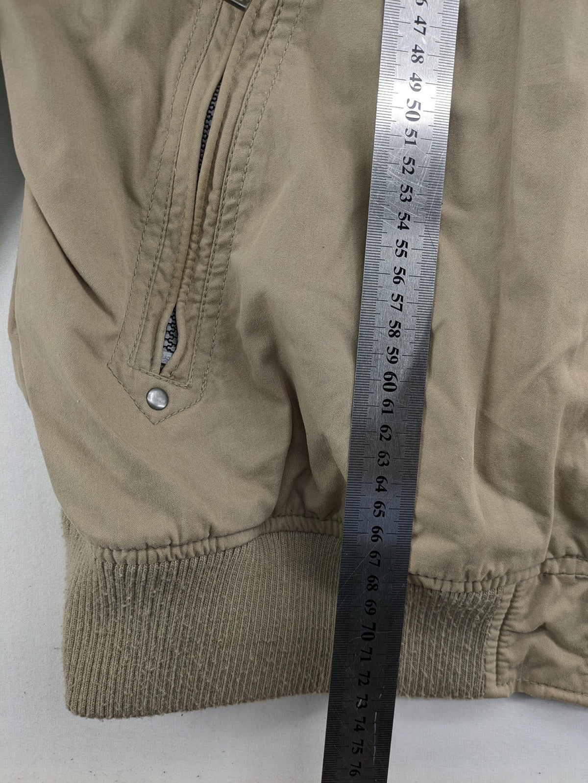 Canda beige bomber jacket full zip with ribbed collar and buttoned chest pockets.