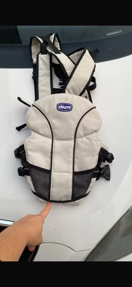Chicco beige and black baby carrier adjustable straps with padded support for comfort.