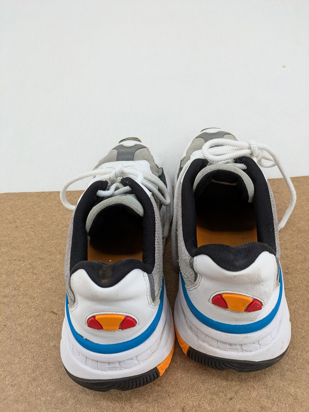 Ellesse Aurora chunky sneakers white grey with orange accents and multi-material upper.