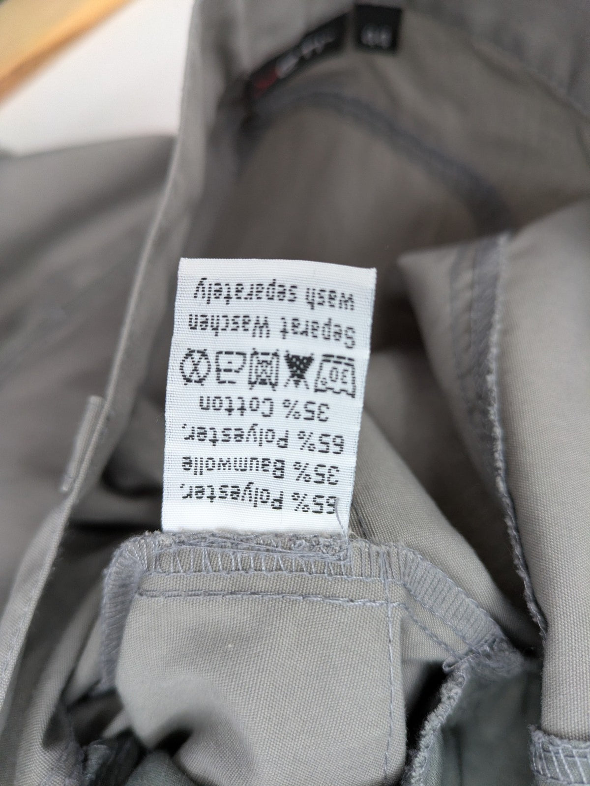 YETI grey cargo pants with multiple zippered pockets and durable material.