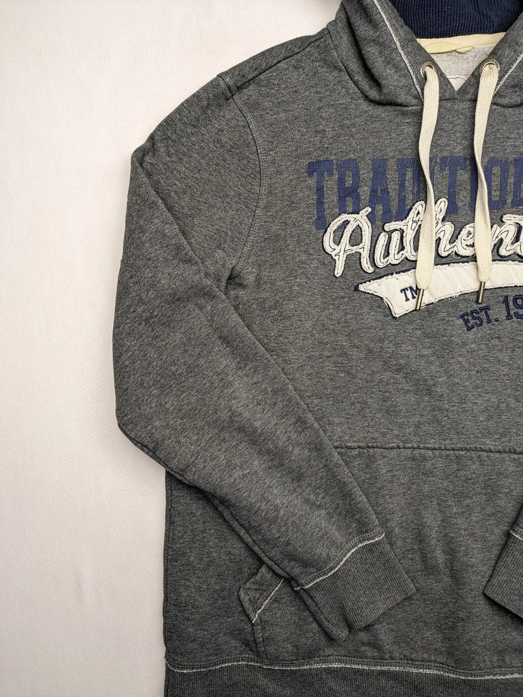 Livergy grey zip-through hoodie with "Traditional Authentic" graphic, kangaroo pocket, soft material.