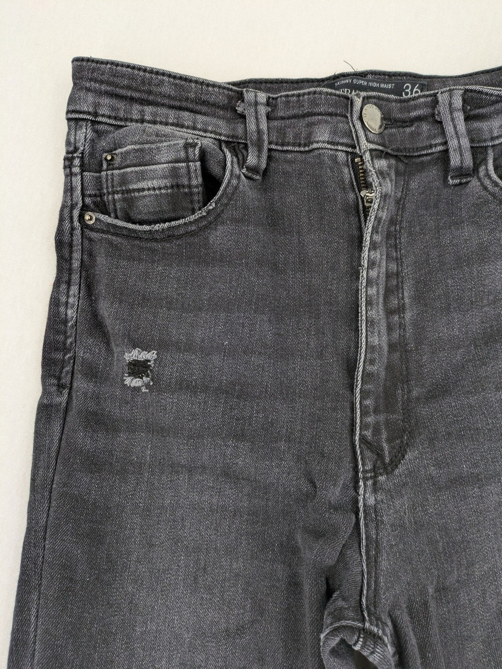 Stradivarius grey skinny jeans super high waist distressed with classic five-pocket design.