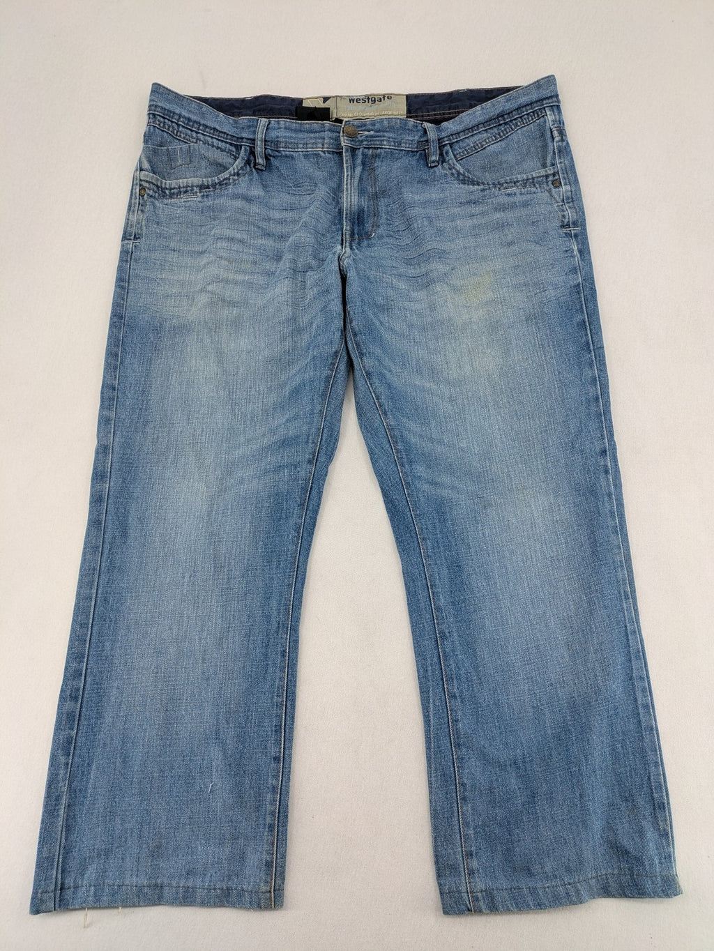 C&A blue straight jeans 5-pocket style with logo and button closure.