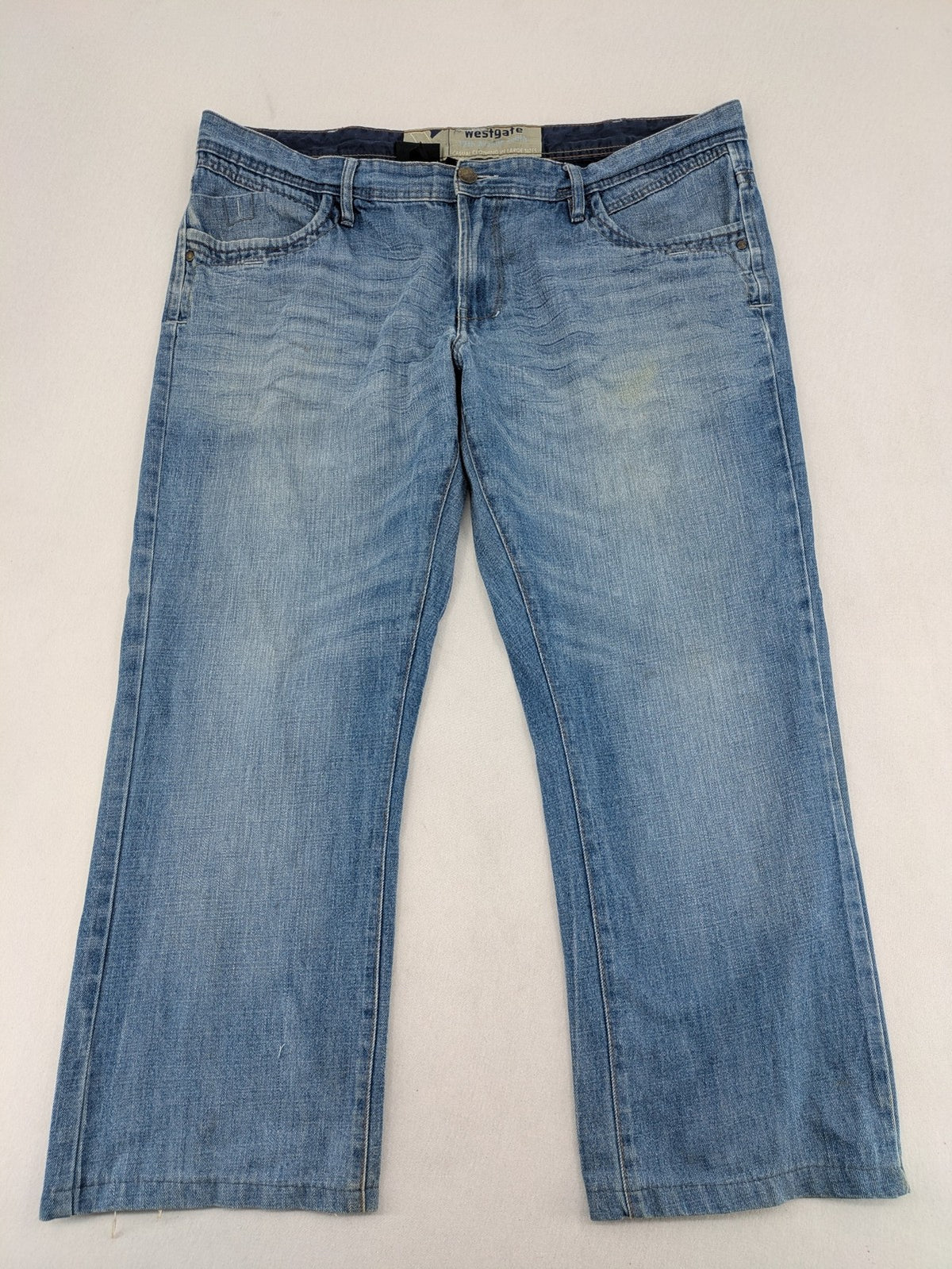 C&A blue straight jeans 5-pocket style with logo and button closure.