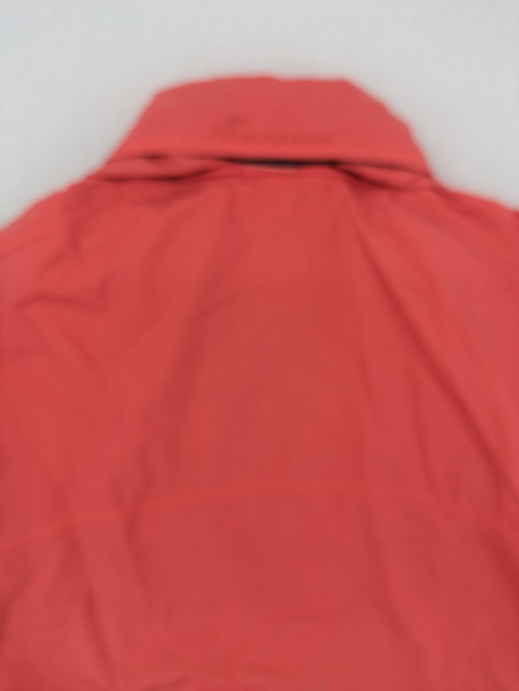 Black Bear black rain jacket with coral pink mesh lining and full zipper.