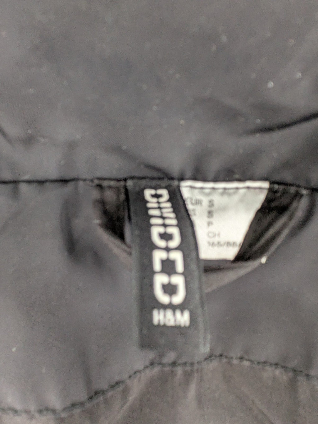 H&M Divided black cropped puffer jacket with zip closure and high collar.