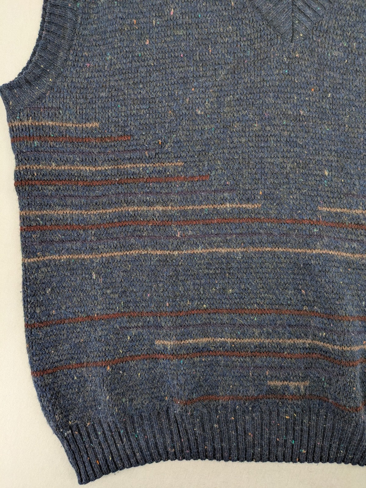 Angelo Litrico blue vest with V-neck, striped pattern, and textured melange design.