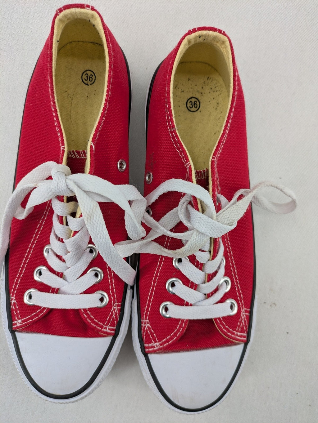 Sneaker low-top canvas sneakers red upper with white laces and rubber sole