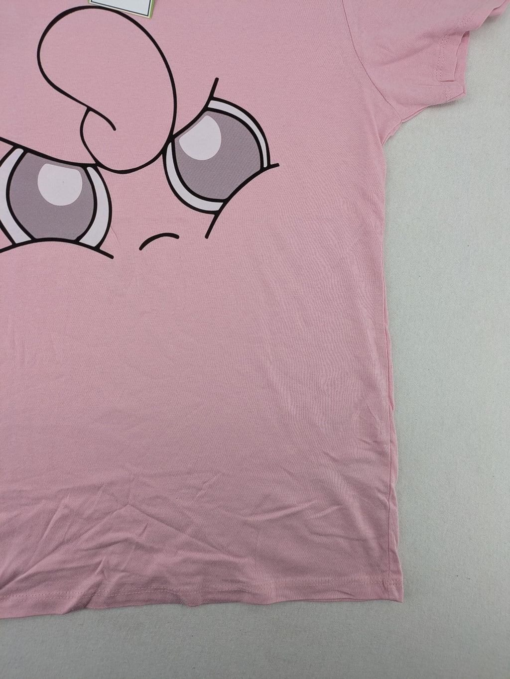 Pokémon pink t-shirt featuring large Jigglypuff graphic and comfortable fit.
