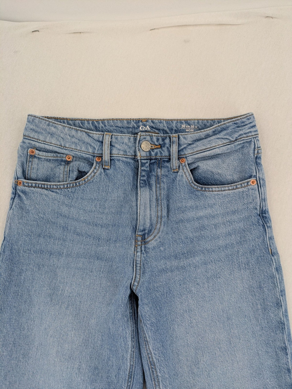 C&A blue mom jeans high waist with unique patchwork design and soft stretch denim.