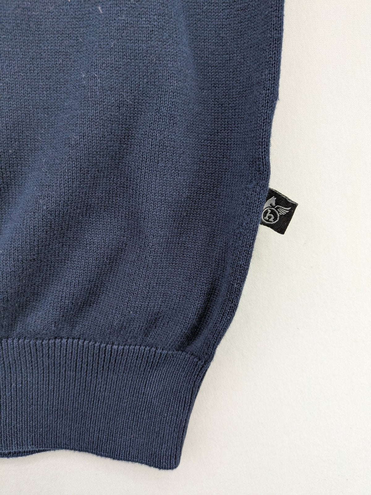 Hajo pink turtle neck jumper with embroidered logo and ribbed cuffs.