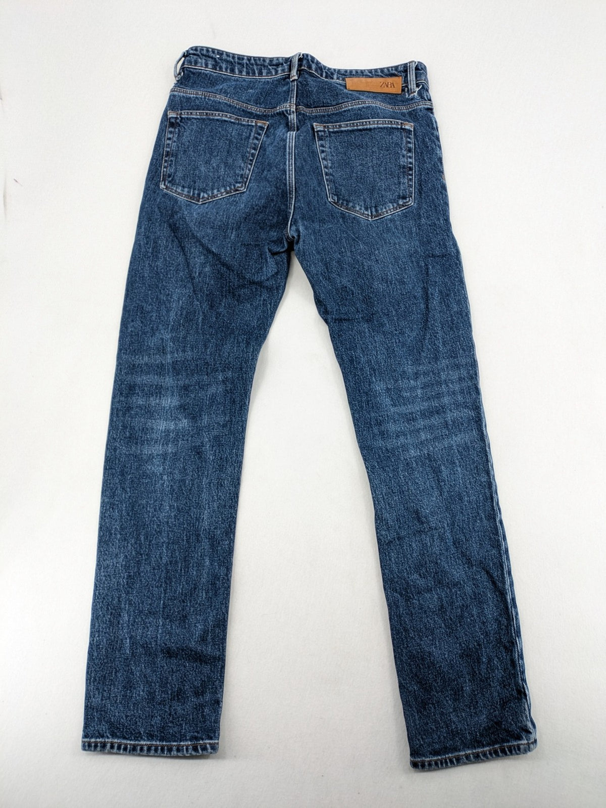 Zara blue straight jeans with classic 5-pocket design and button fly.