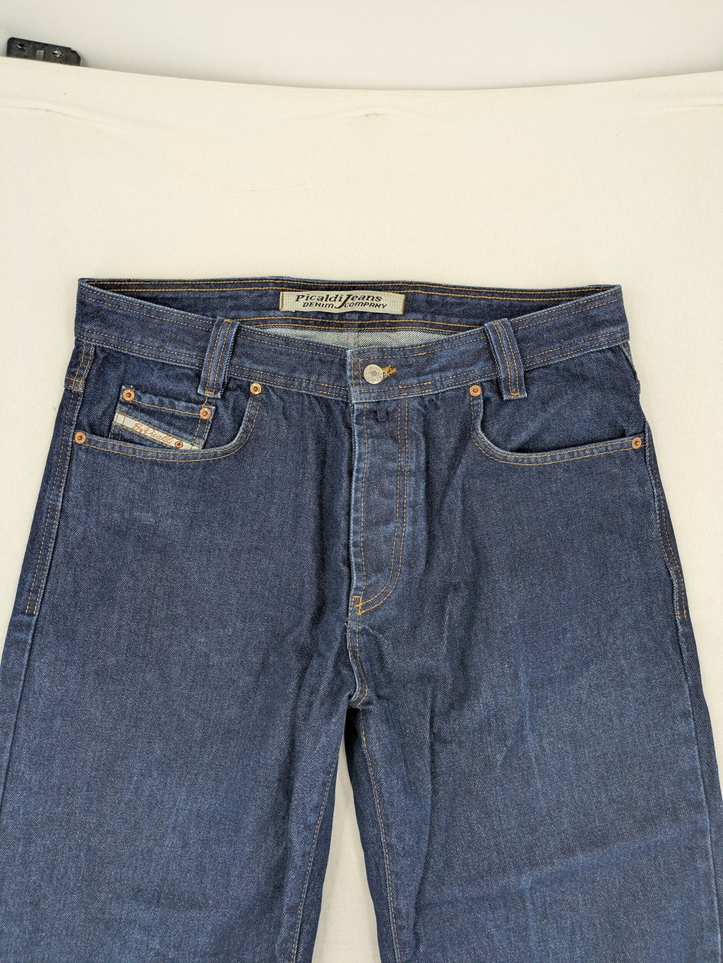 Picaldi blue straight jeans with button fly and frayed hem, 5-pocket design.
