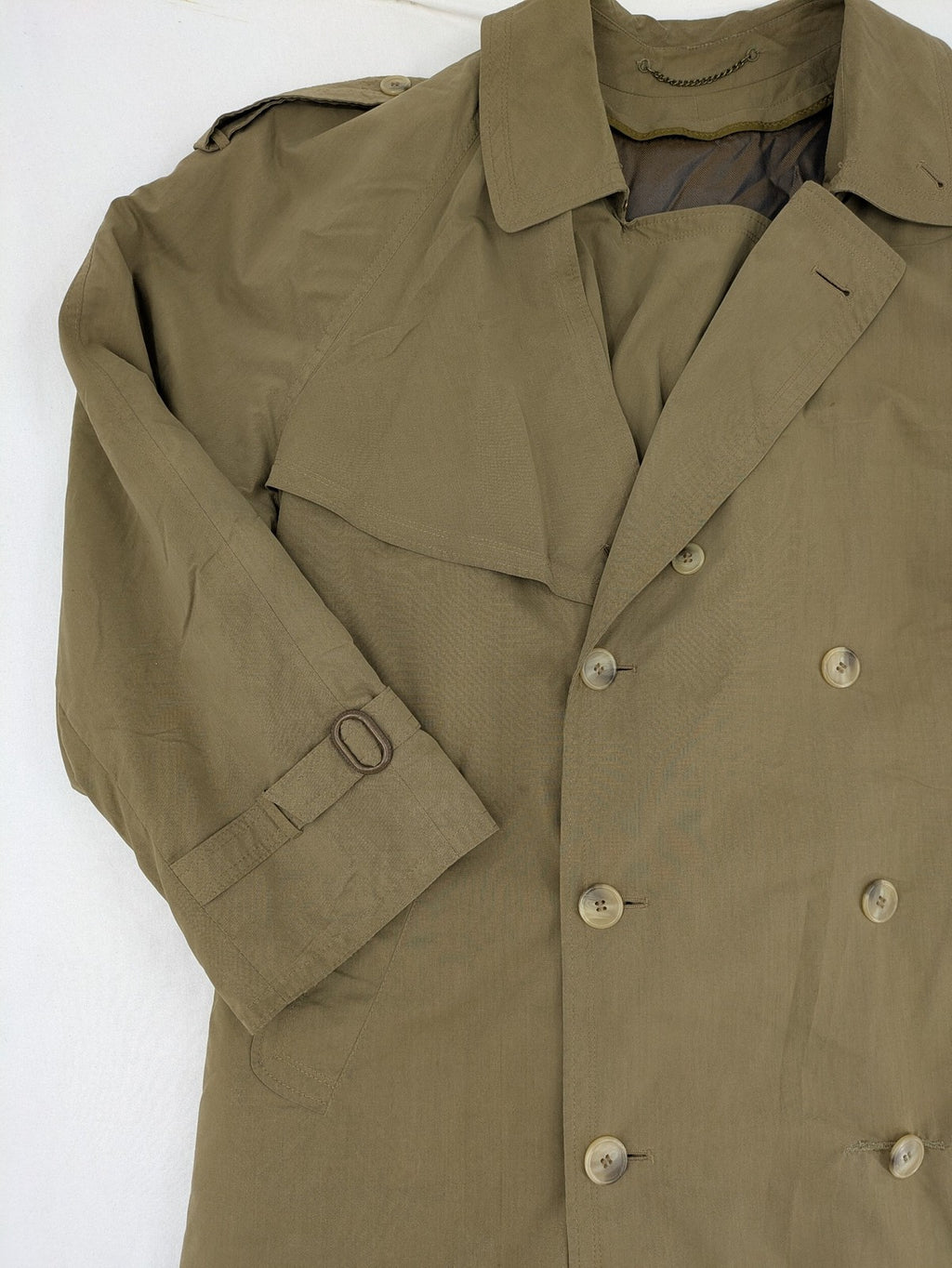 Studio Novum khaki trench coat double-breasted design with belt and wool lining.