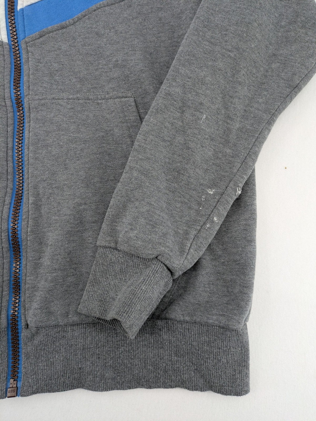 ALIFE turtle neck jumper blue grey colorblock design with logo details and soft cotton blend.