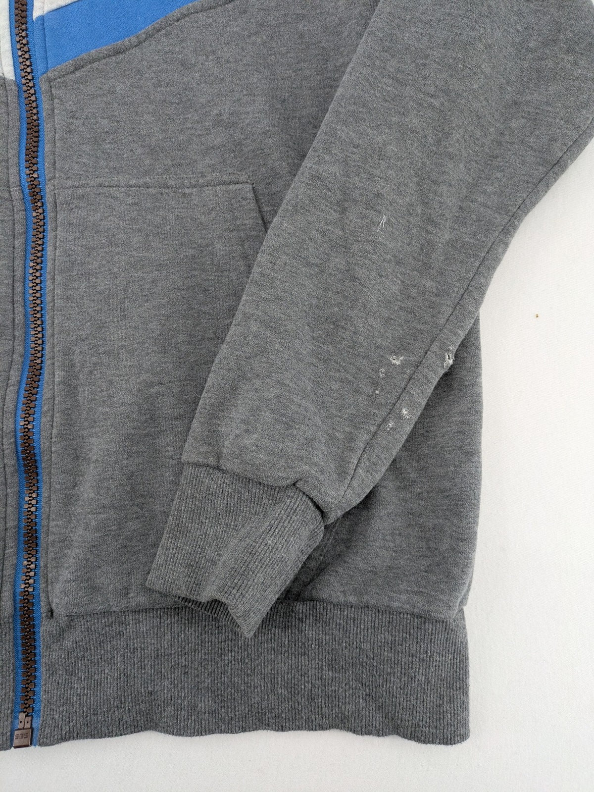 ALIFE turtle neck jumper blue grey colorblock design with logo details and soft cotton blend.