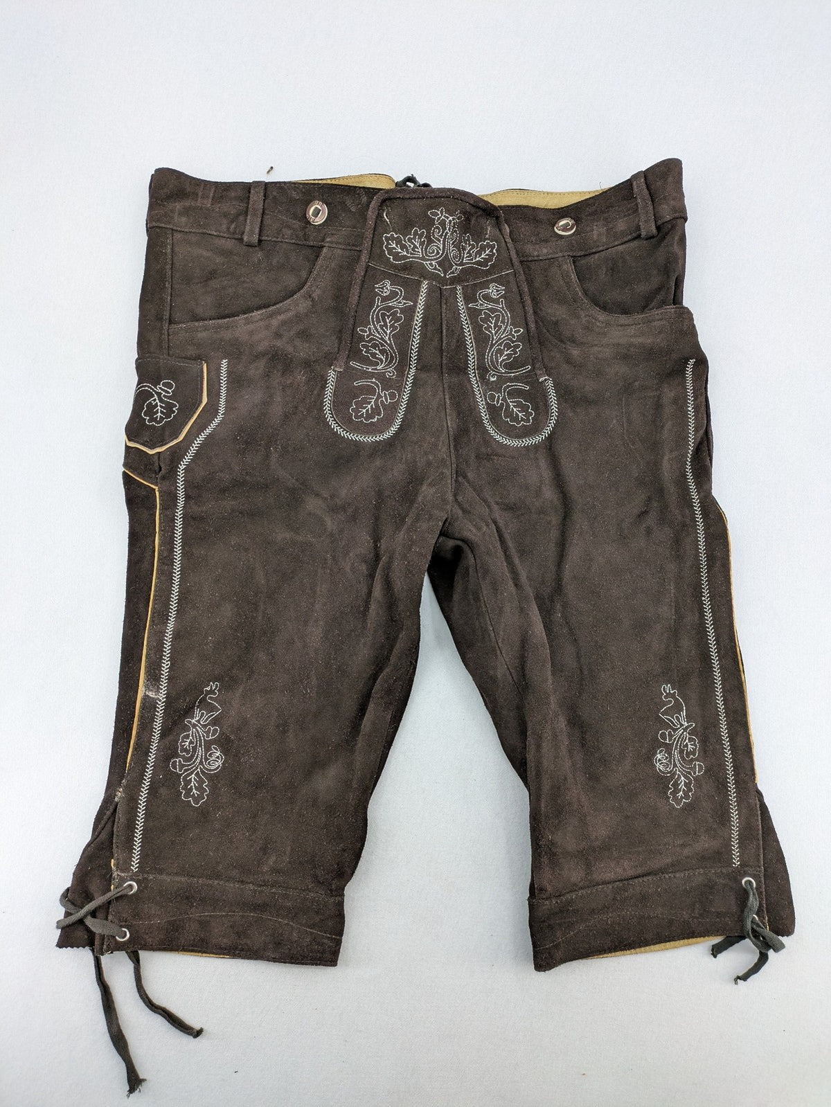 Braun traditional leather pants brown suede with intricate embroidery on bib and legs.