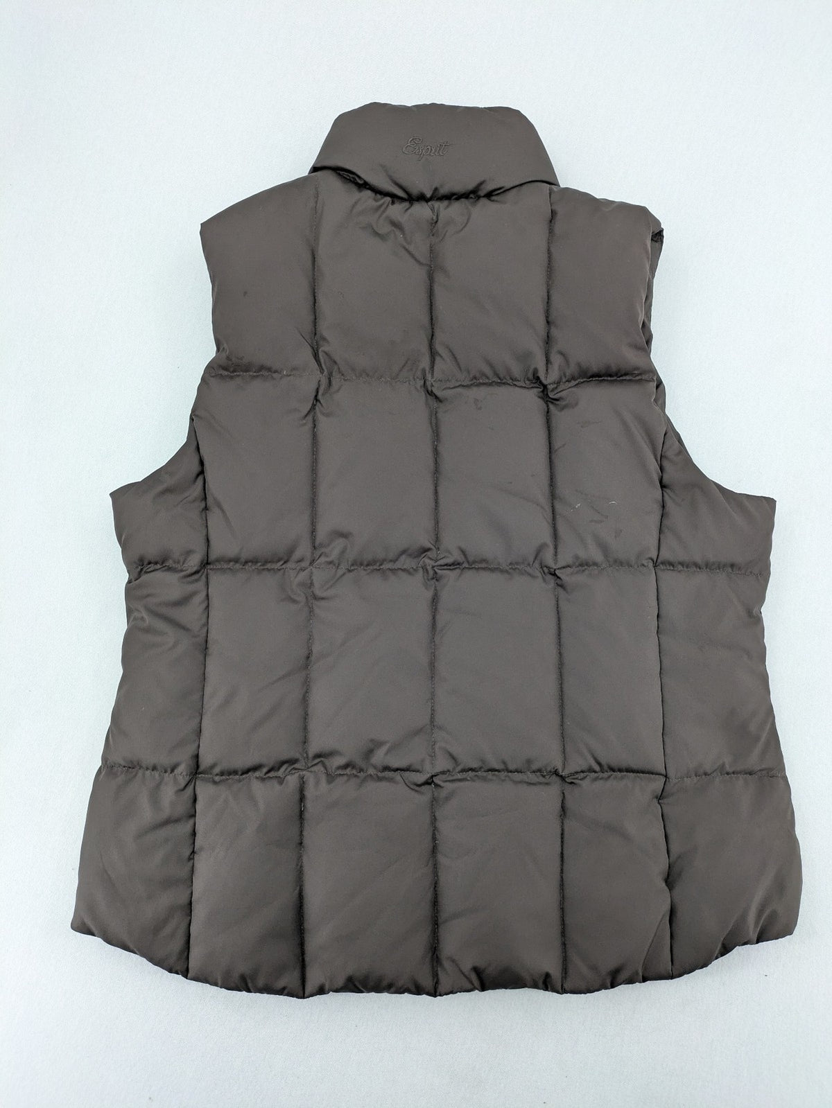 Esprit brown puffer vest with high ribbed collar and zip button closure.