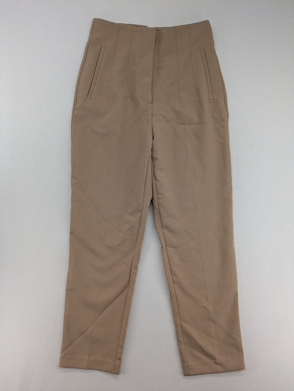 Tapered beige pants high-waist tapered fit with classic front creases and side pockets.