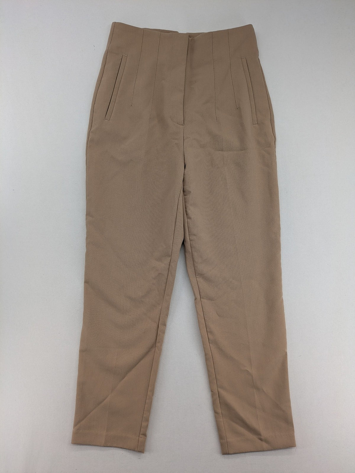 Tapered beige pants high-waist tapered fit with classic front creases and side pockets.