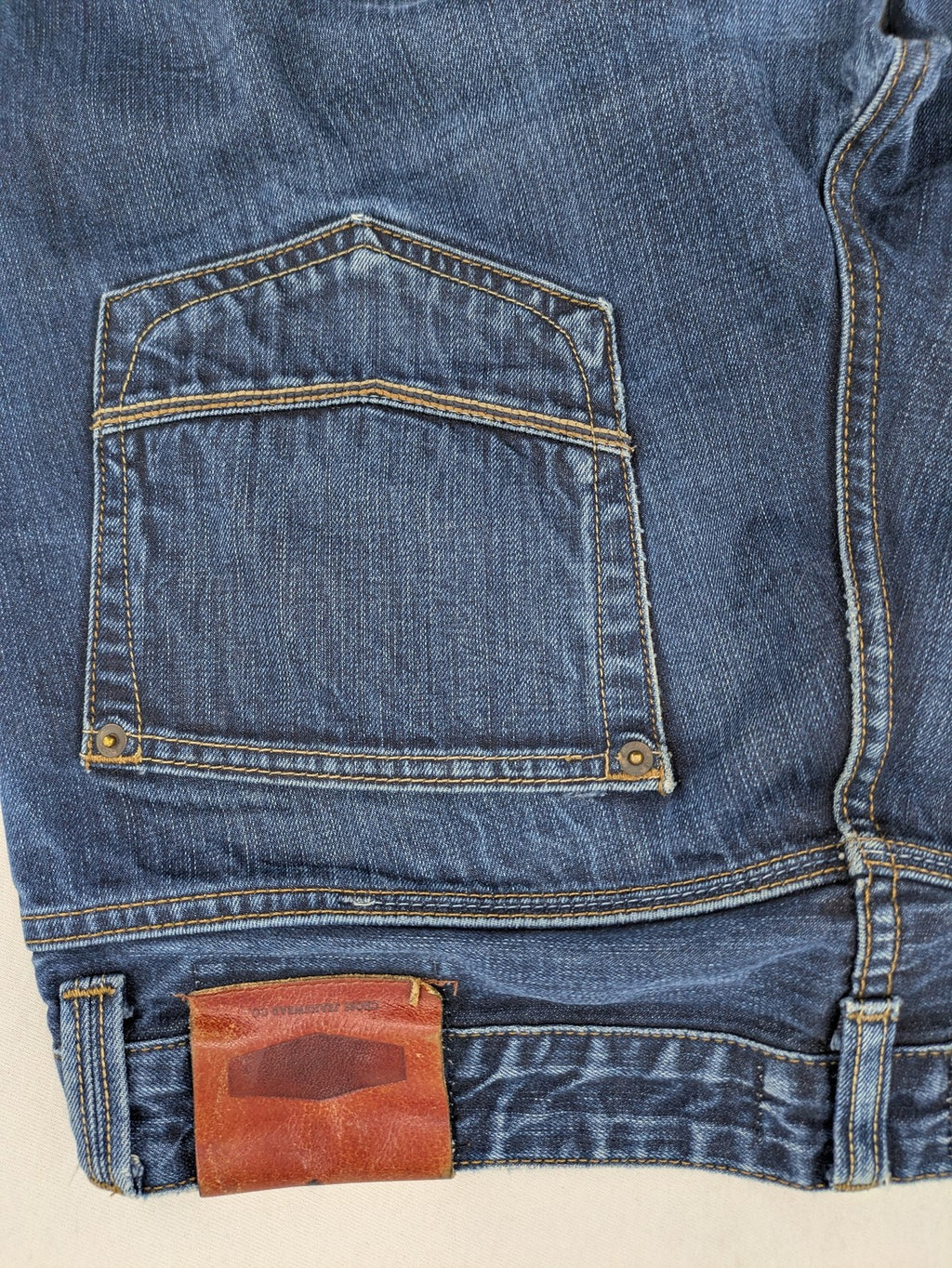 W32 blue straight jeans with classic 5-pocket design and dark wash denim.