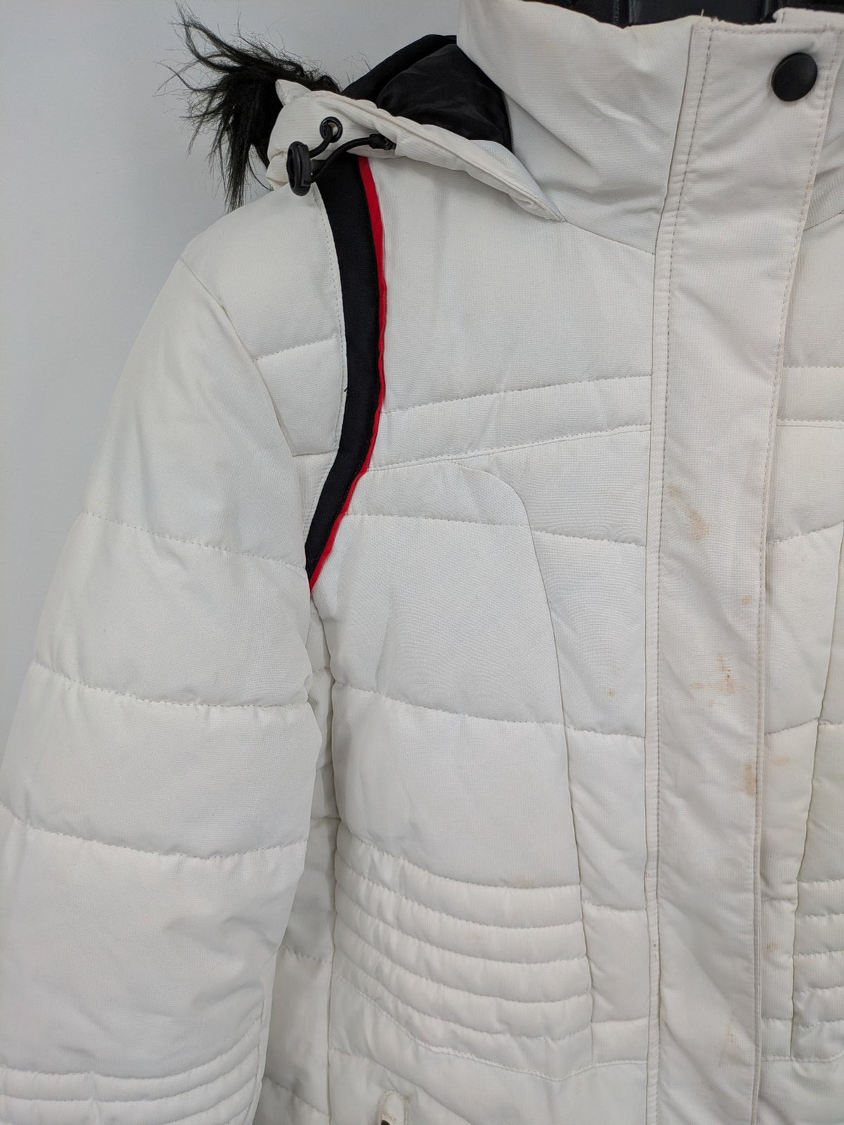 Janina white puffer jacket with quilted design and faux fur hood accents.