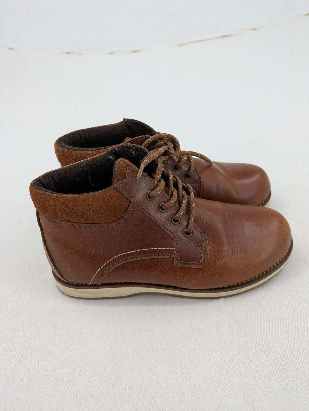 Firetrap brown motorcycle boots with classic lace-up design and padded ankle support.