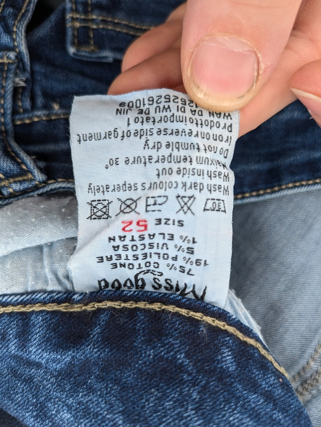 Miss Good blue straight jeans with 5-pocket design and decorative metal accent.