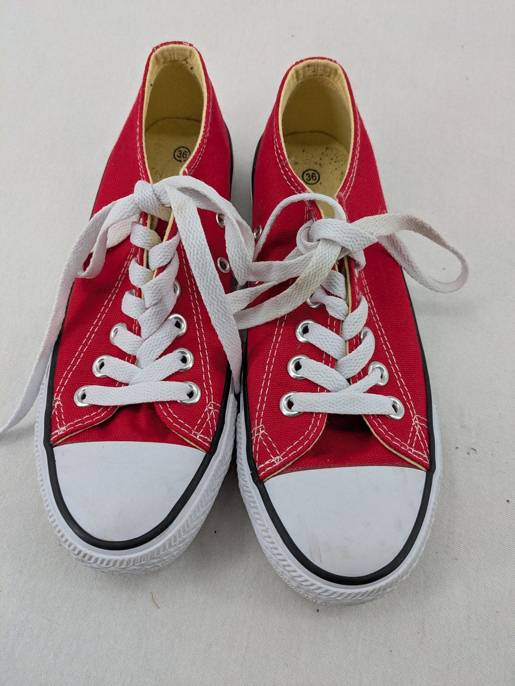 Sneaker low-top canvas sneakers red upper with white laces and rubber sole