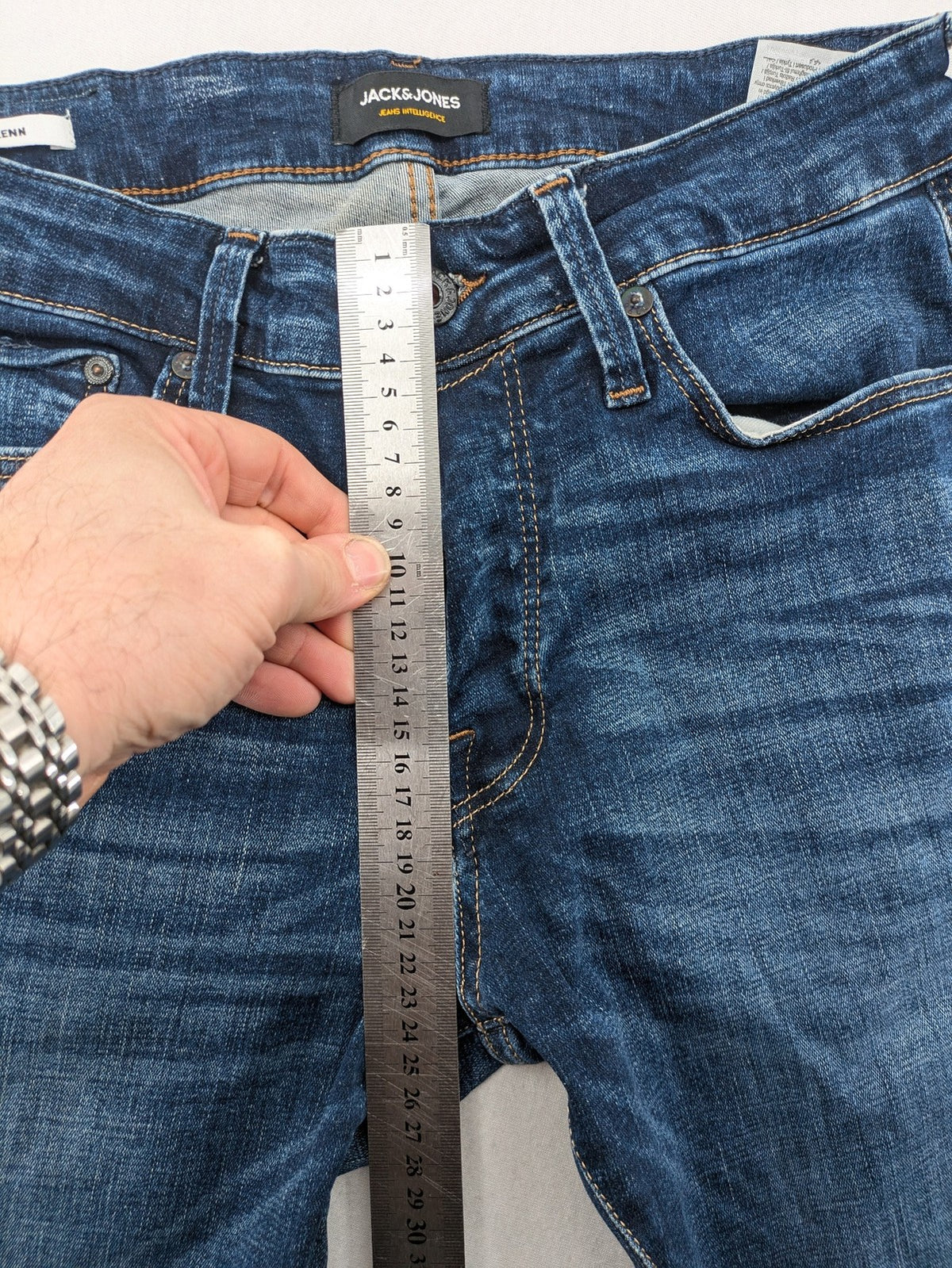 Jack & Jones blue slim fit jeans with faded wash and classic button fly.