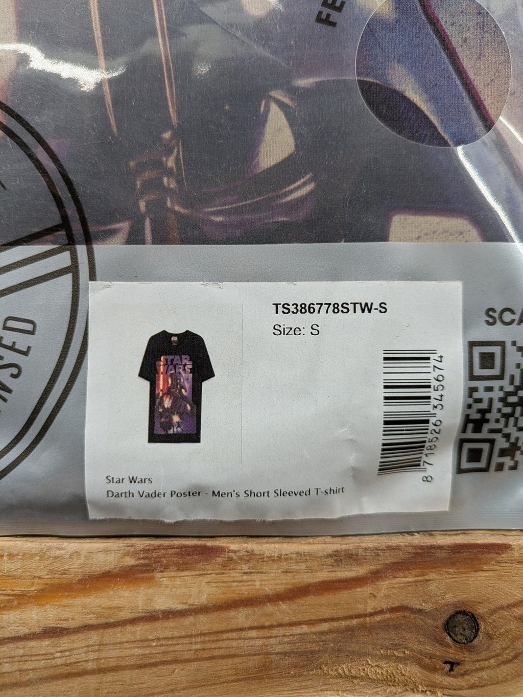 Star Wars black t-shirt featuring bold Darth Vader poster graphic, short sleeves.