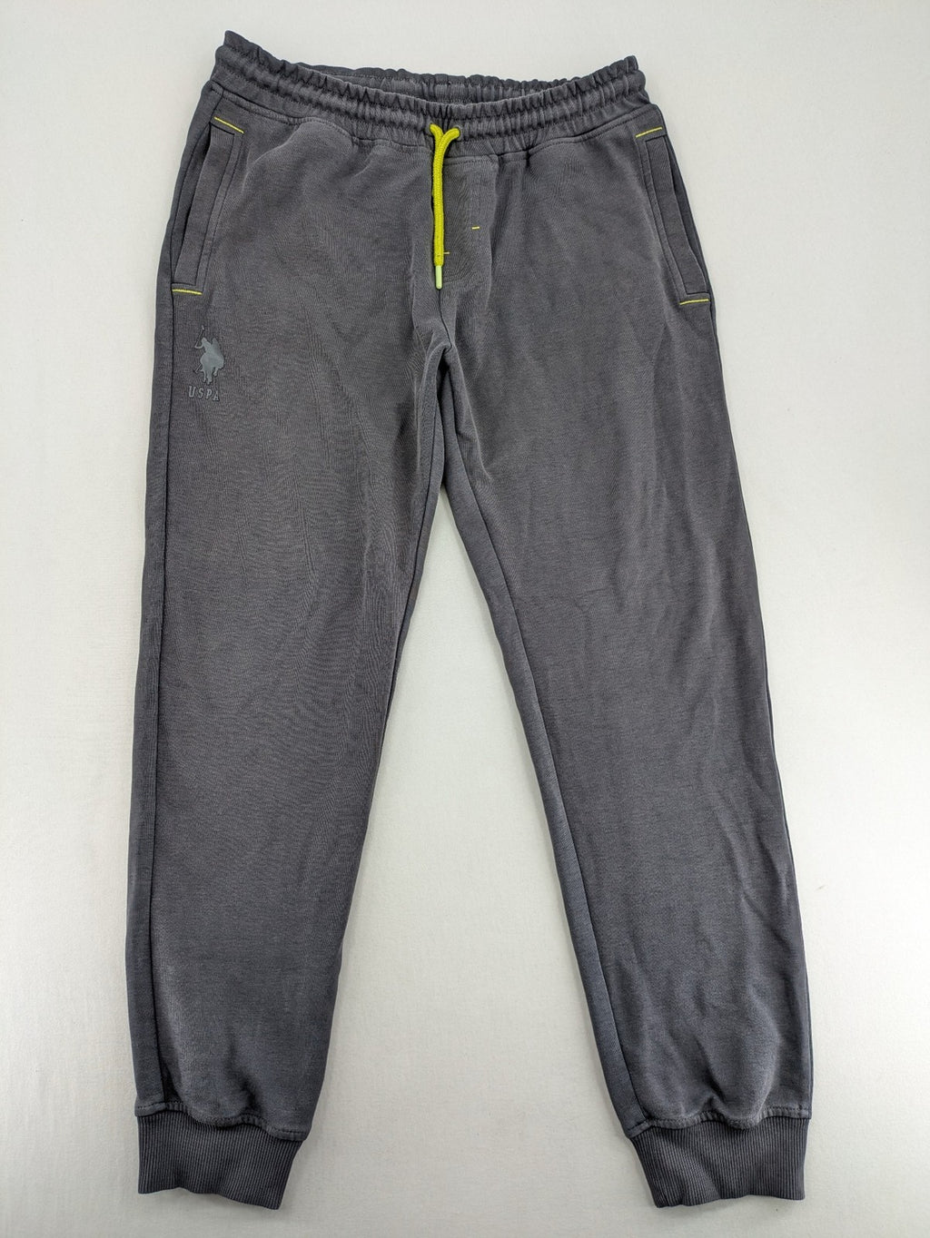 US Polo Assn grey sweatpants with light green drawstring and subtle logo detail.