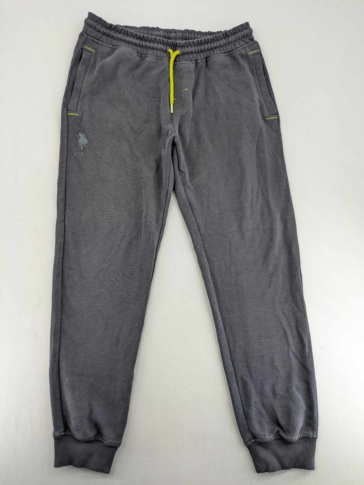 US Polo Assn grey sweatpants with light green drawstring and subtle logo detail.