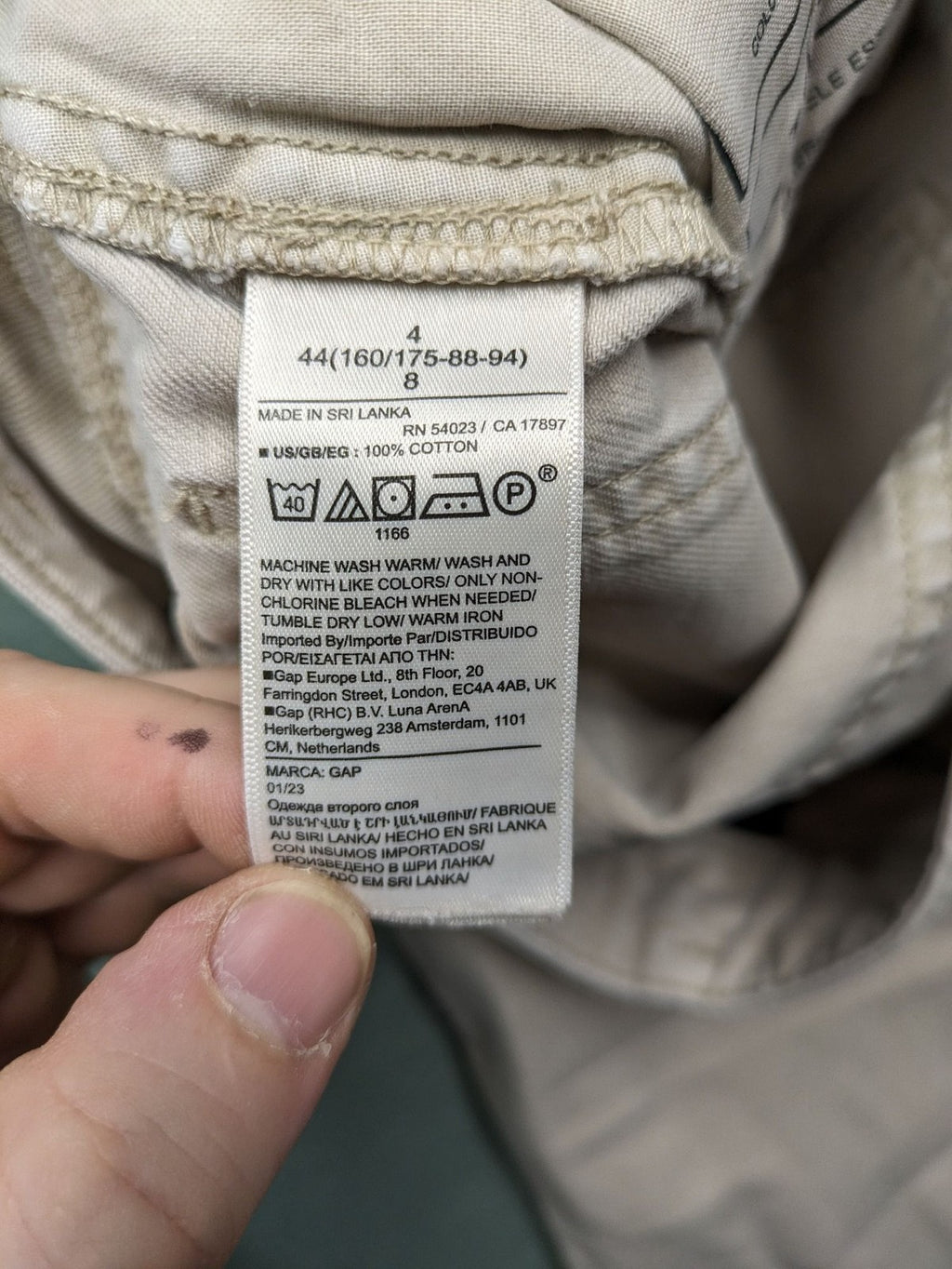 Gap beige loose-fit chino pants made from 100% cotton with relaxed wide-leg design.