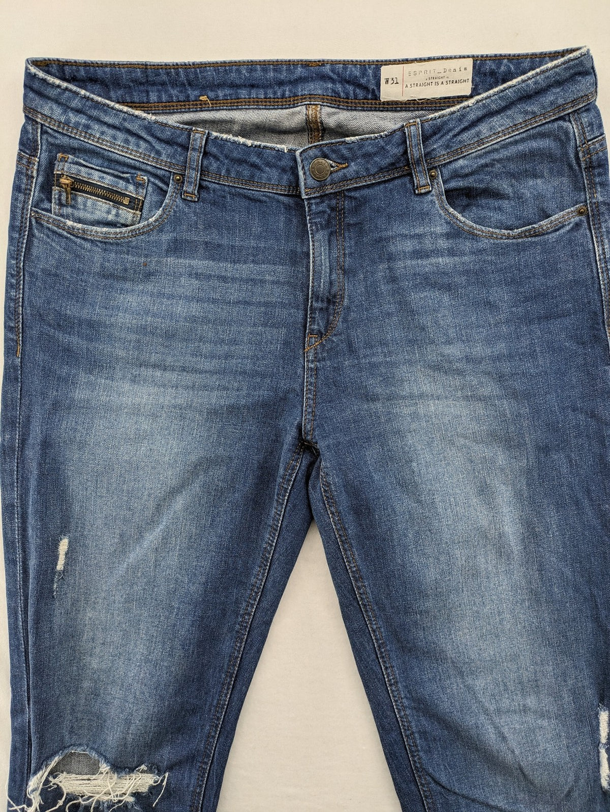 Esprit blue straight leg jeans with ripped knee details and rolled hem.