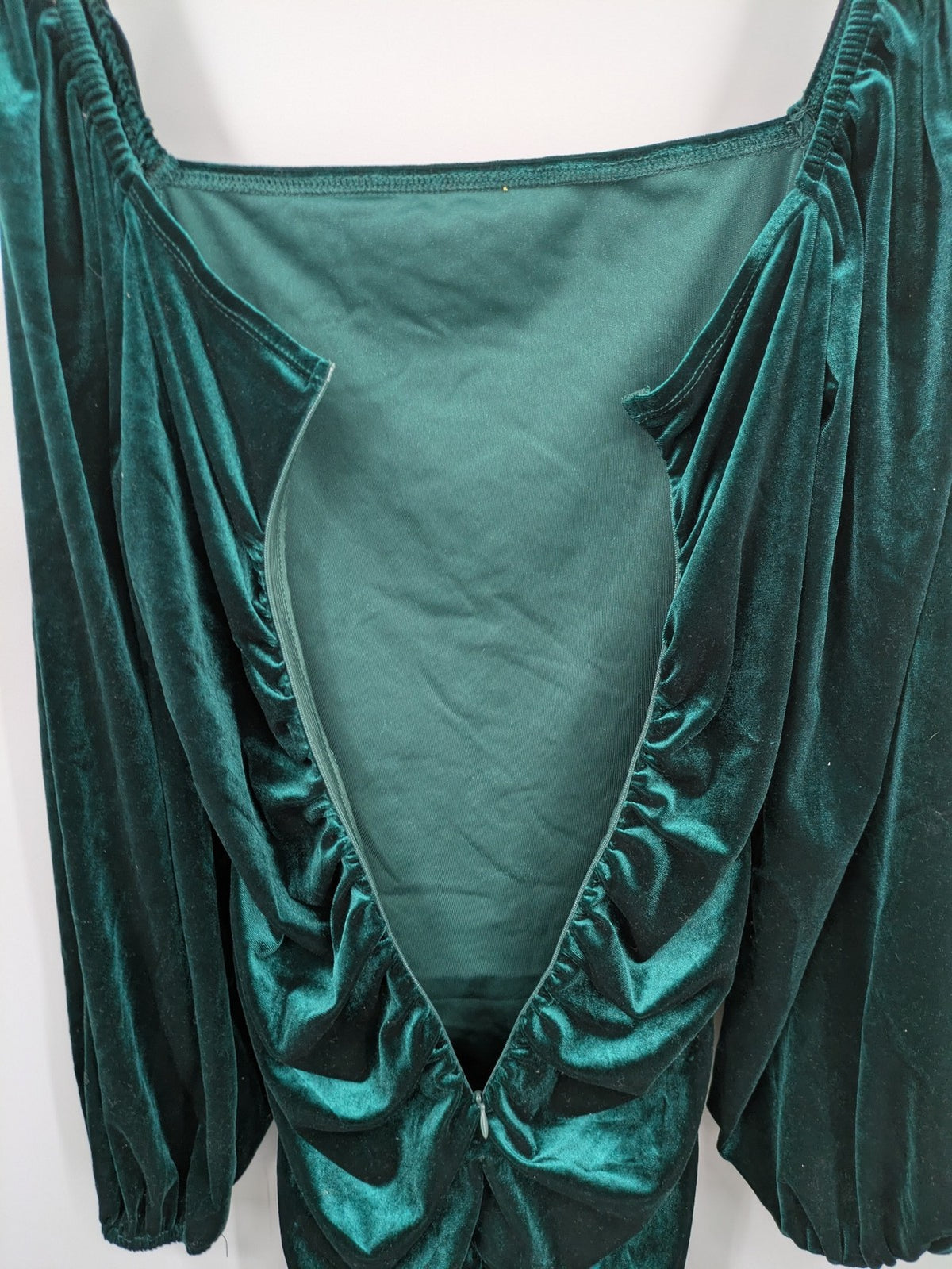 SHEIN green bodycon dress with ruched details, square neckline, and long puff sleeves.