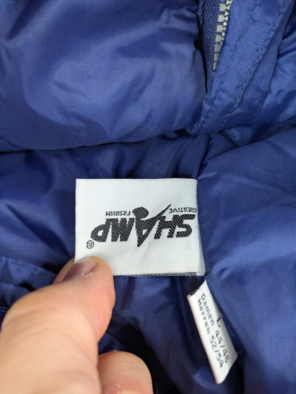 Shamp navy and yellow vintage ski jacket and pants set with retro design.