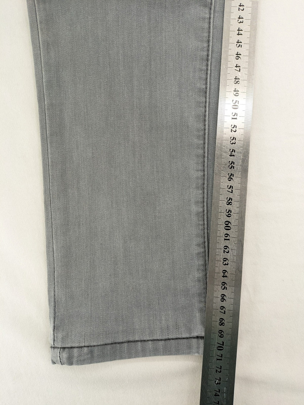 Born Rich grey slim fit jeans with logo patch and washed denim look.