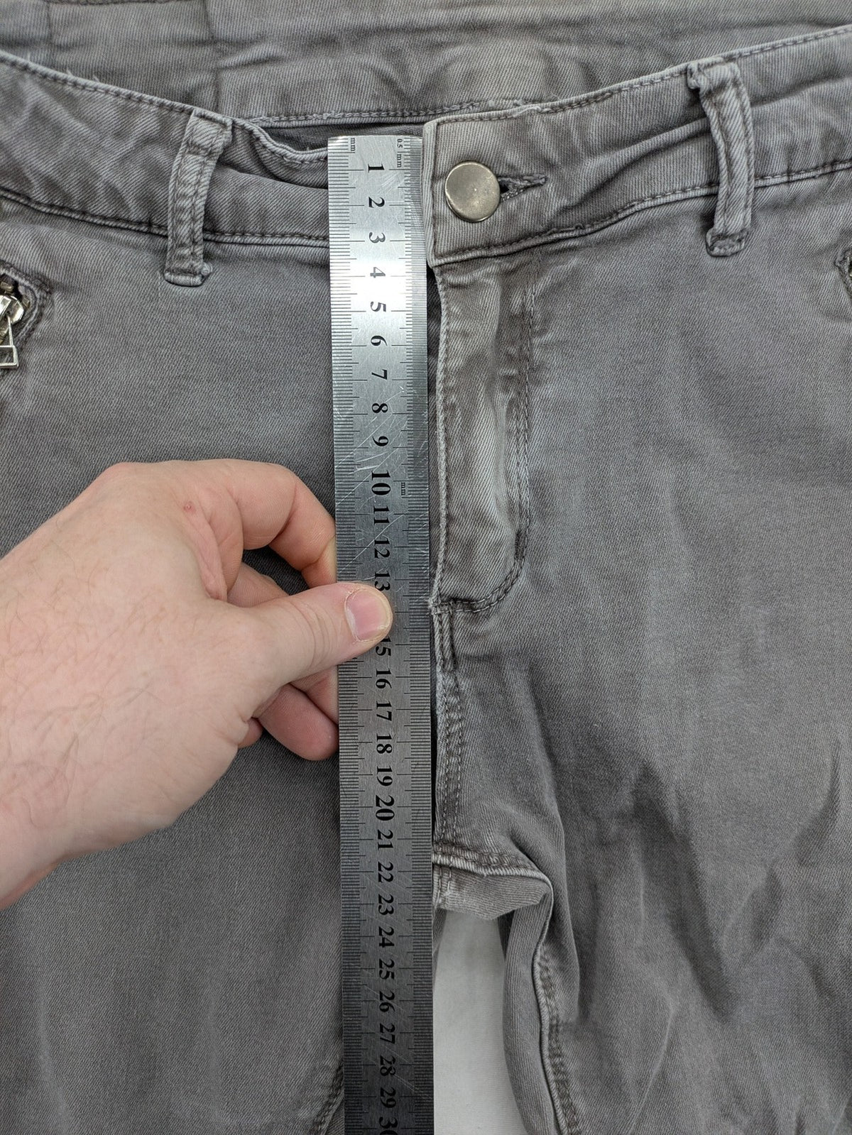 Made in Italy grey biker jeans with zip pockets and structured knee detailing.